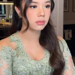 Lita Gading, seorang psikolog, digugat oleh Ahmad Dhani setelah memberikan komentar tentang gaya berpakaian Safeea Ahmad. Foto ini menampilkan Lita Gading dan Ahmad Dhani, yang menggambarkan konflik antara keduanya